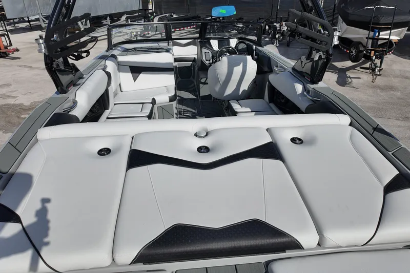  Yacht Photos Pics 2025 Supreme S220 boat interior with sleek white and black seating design.
