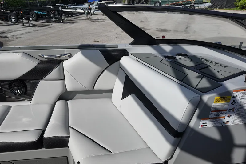  Yacht Photos Pics 2025 Supreme S220 boat interior with sleek white and black seating design.