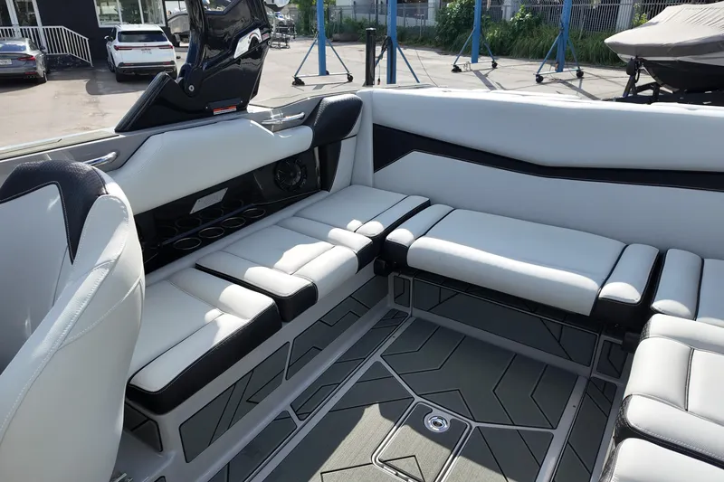  Yacht Photos Pics 2025 Supreme S220 boat interior with sleek white seating and modern design elements.