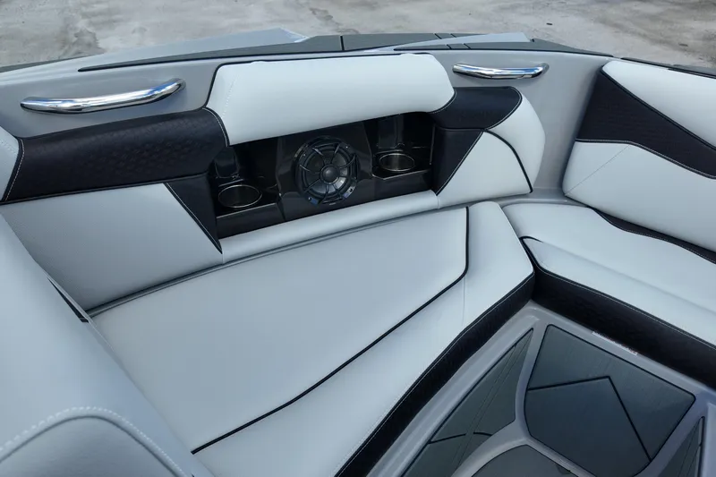  Yacht Photos Pics Luxurious interior of 2025 Supreme S220 boat with sleek seating and built-in speaker.