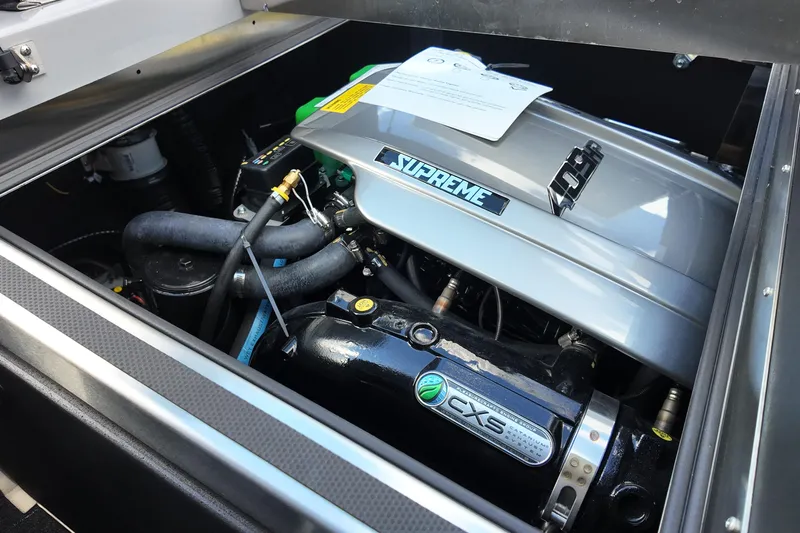  Yacht Photos Pics Engine compartment of 2025 Supreme S220 boat, featuring CXS components and detailed mechanical parts.