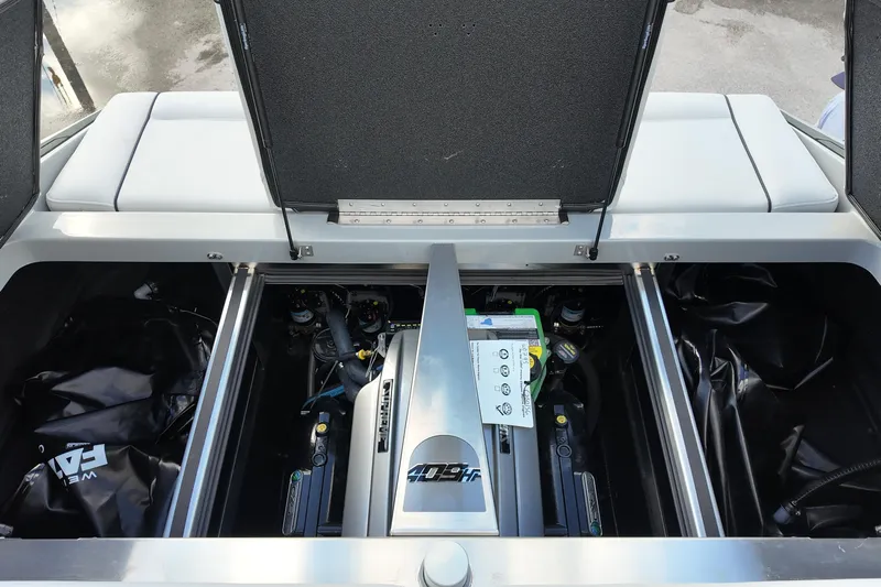  Yacht Photos Pics Engine compartment of 2025 Supreme S220 boat, showcasing powerful motor and components.