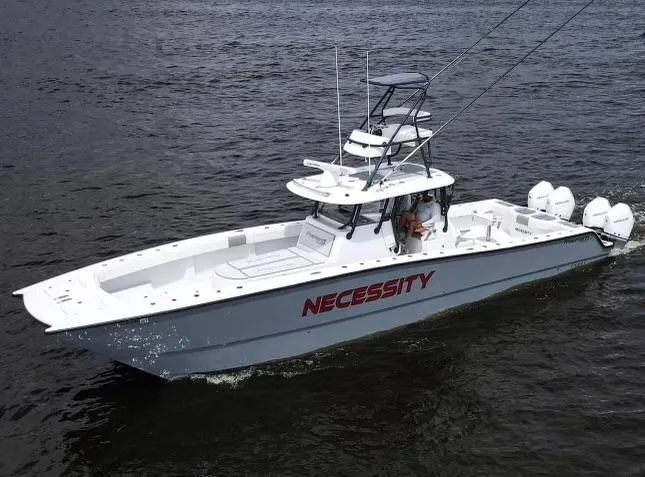 Necessity Yacht Photos Pics Freeman 42LR 2018 boat named "Necessity" cruising on water.