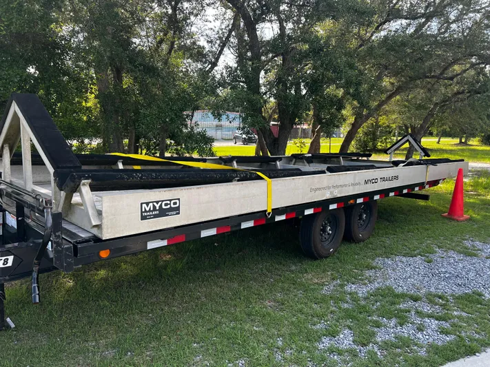 Necessity Yacht Photos Pics Trailer for Freeman 42LR 2018, parked on grass, with Myco branding and safety cone nearby.