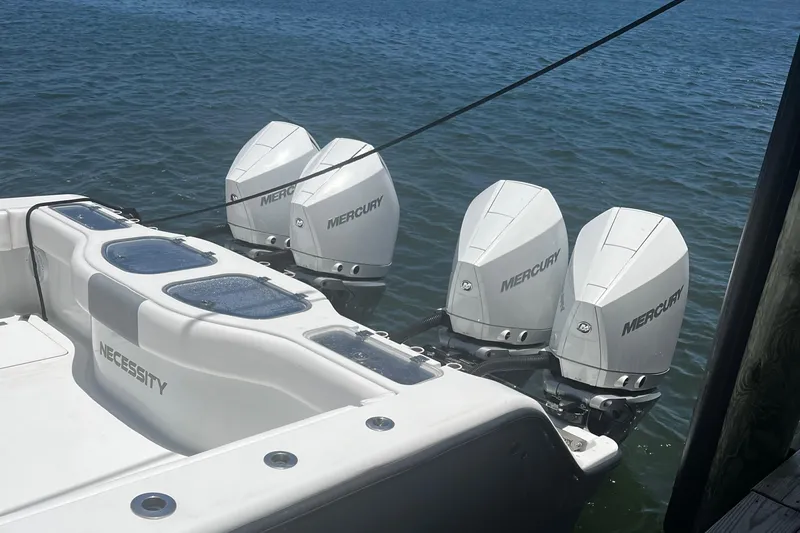Necessity Yacht Photos Pics 2018 Freeman 42LR boat with four Mercury outboard engines on water.