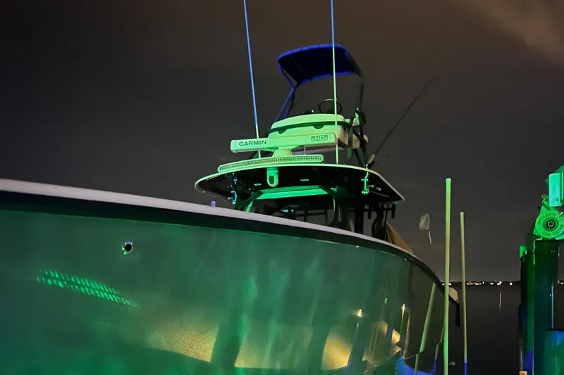 Necessity Yacht Photos Pics Freeman 42LR 2018 boat illuminated at night with green lights.