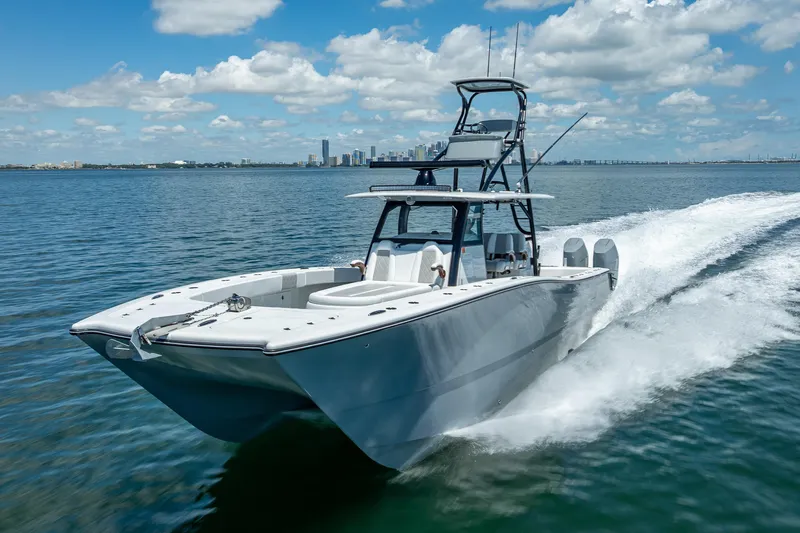  Yacht Photos Pics 2024 Freeman 43 boat cruising on open water under a clear blue sky.
