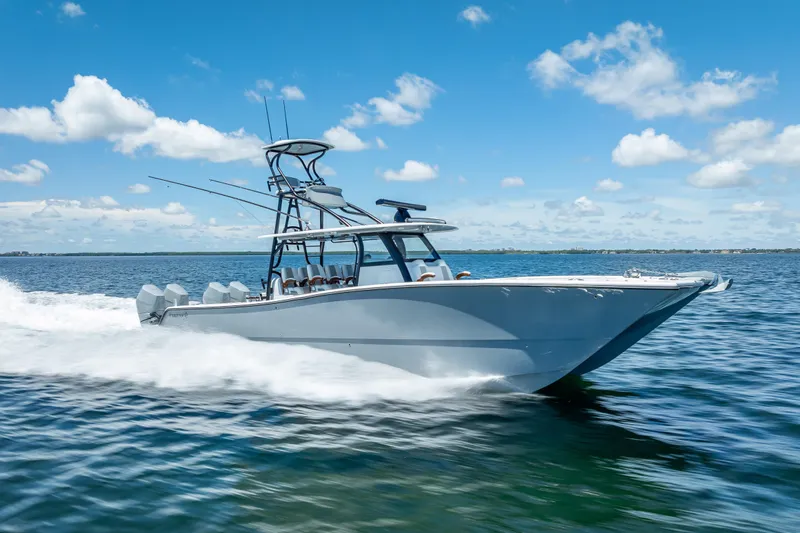  Yacht Photos Pics 2024 Freeman 43 boat cruising on open water under a clear blue sky.