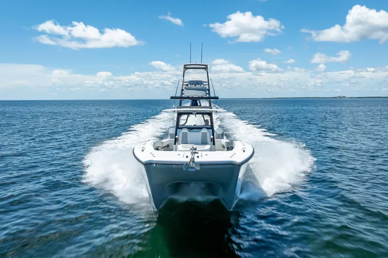  Yacht Photos Pics 2024 Freeman 43 boat cruising on open water under a clear blue sky.