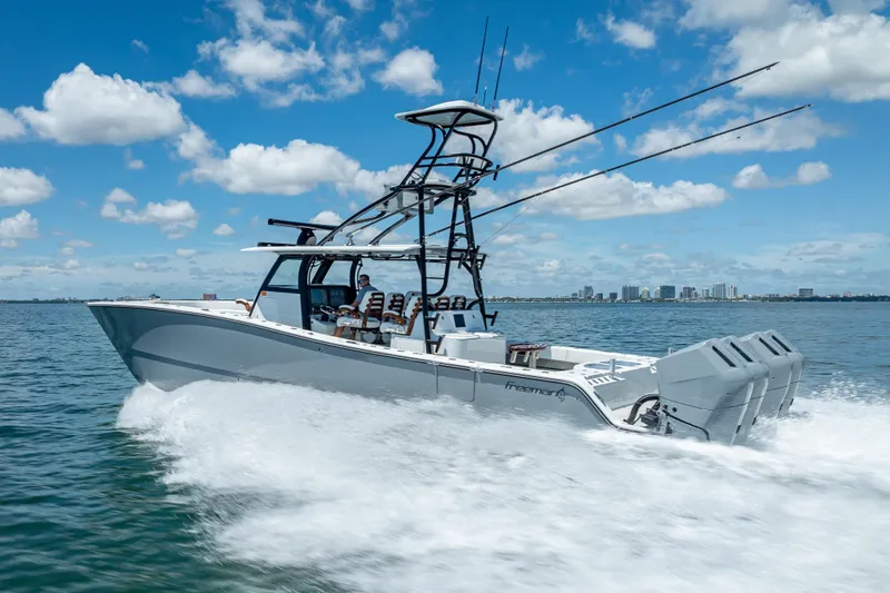  Yacht Photos Pics 2024 Freeman 43 boat cruising on open water under a clear blue sky.