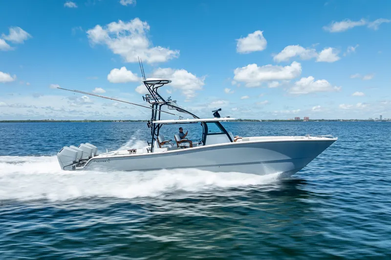  Yacht Photos Pics 2024 Freeman 43 boat cruising on open water under a clear blue sky.