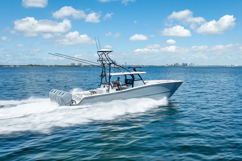  Yacht Photos Pics 2024 Freeman 43 boat cruising on open water under a clear blue sky.