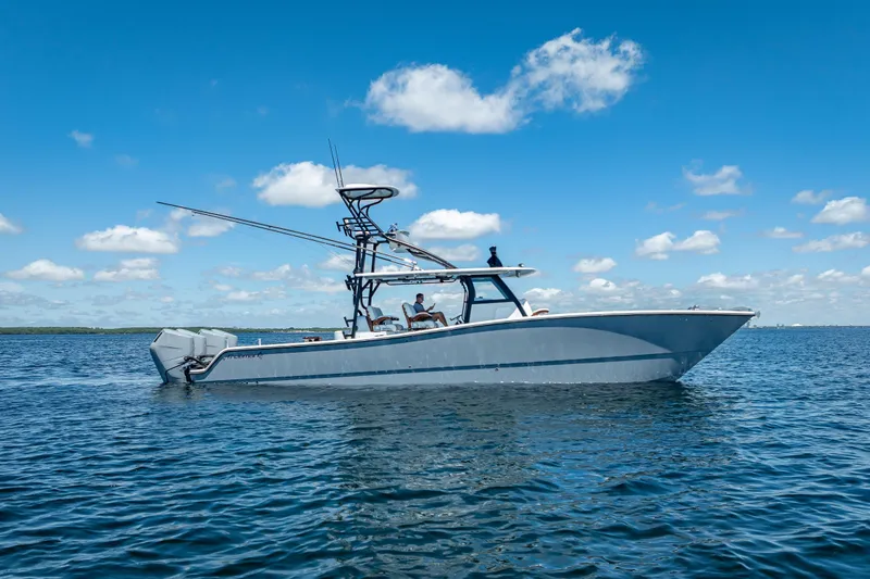  Yacht Photos Pics 2024 Freeman 43 boat on calm water under a clear blue sky.