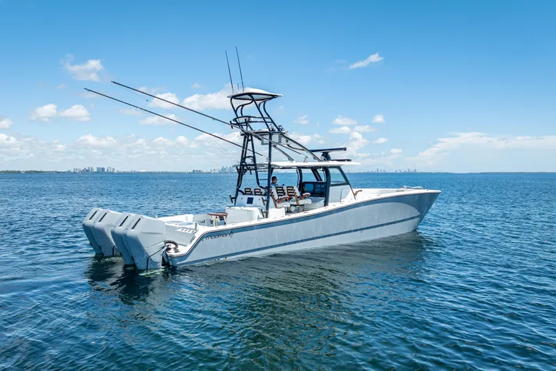  Yacht Photos Pics 2024 Freeman 43 boat on calm blue water under clear sky.