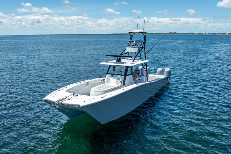  Yacht Photos Pics 2024 Freeman 43 boat on open water, clear sky, and calm sea.