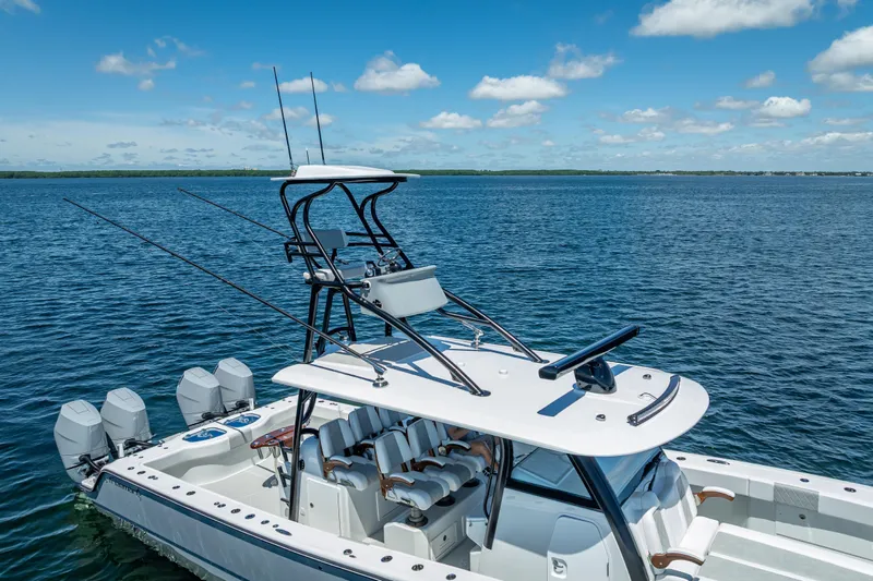  Yacht Photos Pics 2024 Freeman 43 boat on open water, featuring multiple outboard engines and a sleek design.