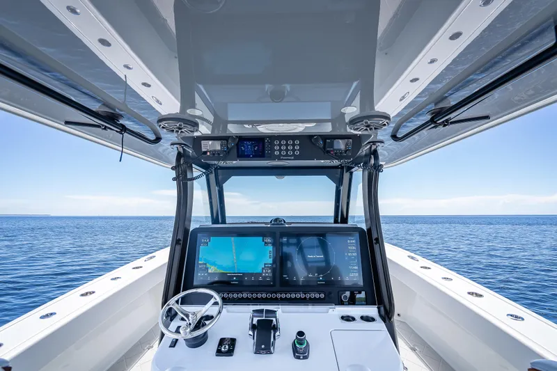  Yacht Photos Pics 2024 Freeman 43 boat cockpit with advanced navigation system on open sea.