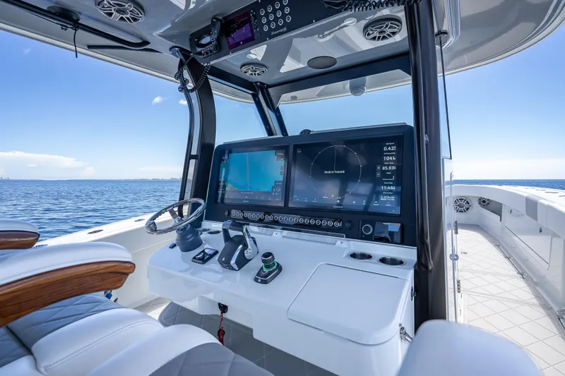  Yacht Photos Pics 2024 Freeman 43 boat cockpit with advanced navigation system and ocean view.