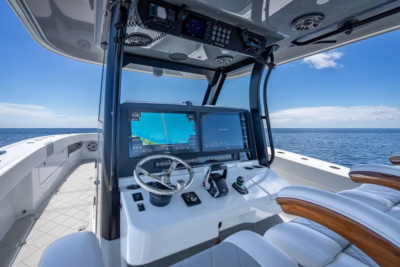  Yacht Photos Pics 2024 Freeman 43 boat cockpit with advanced navigation system and ocean view.