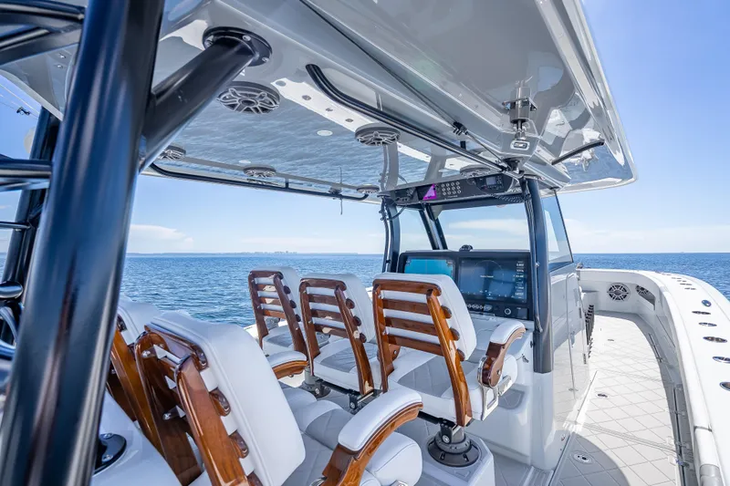  Yacht Photos Pics 2024 Freeman 43 boat interior with modern helm, luxurious seating, and ocean view.