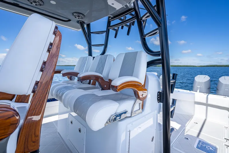  Yacht Photos Pics Luxury seating on 2024 Freeman 43 boat with ocean backdrop.