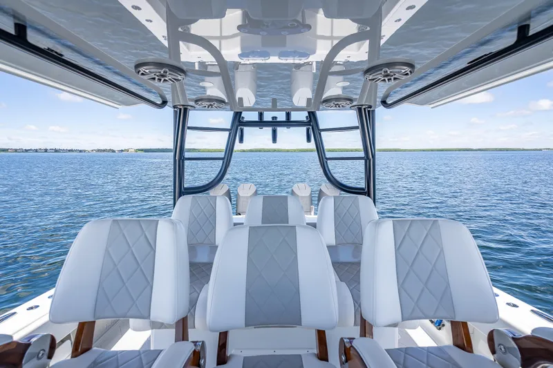  Yacht Photos Pics 2024 Freeman 43 boat interior with luxurious seating on open water.