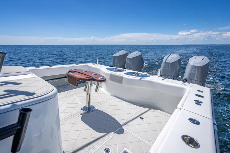  Yacht Photos Pics Freeman 43 boat, 2024 model, with multiple engines on open sea under clear blue sky.