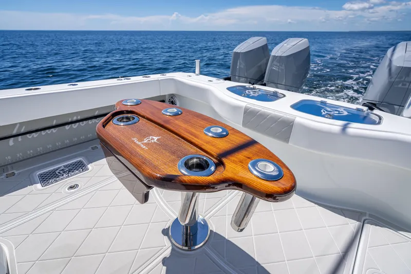  Yacht Photos Pics Luxury Freeman 43 boat deck with polished wood table, ocean view, 2024 model.