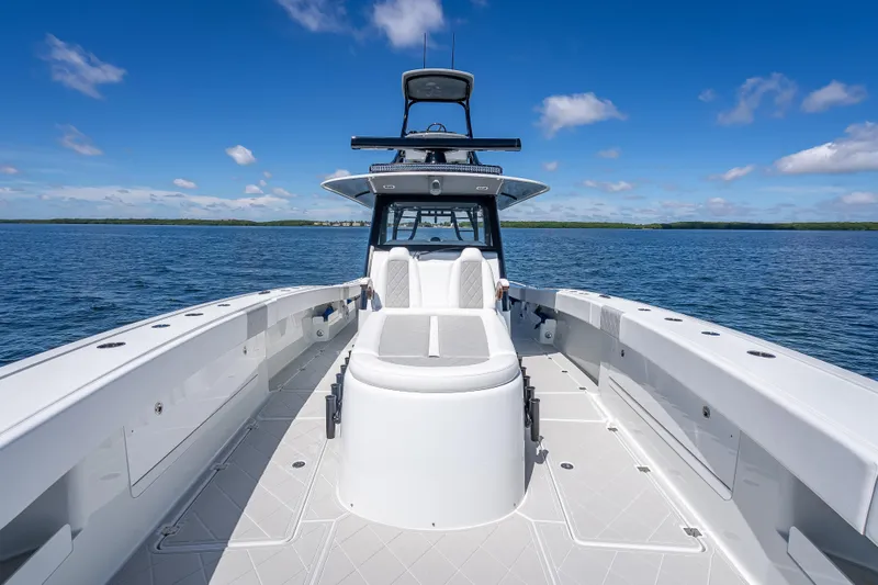  Yacht Photos Pics 2024 Freeman 43 boat on calm water under a clear blue sky.