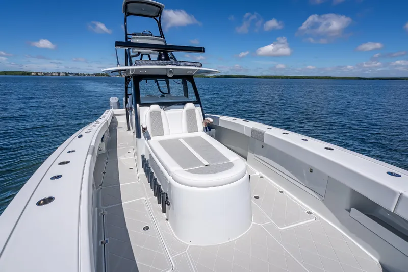  Yacht Photos Pics 2024 Freeman 43 boat on calm water, featuring sleek design and spacious deck.