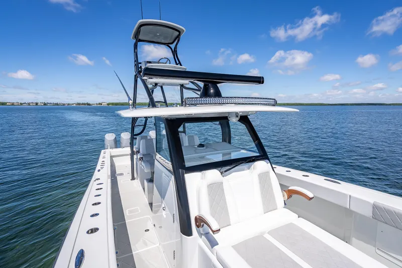  Yacht Photos Pics 2024 Freeman 43 boat on calm water under clear blue sky.