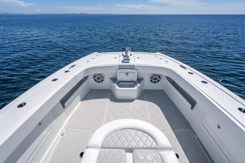  Yacht Photos Pics Bow view of 2024 Freeman 43 boat on open water, showcasing spacious deck design.