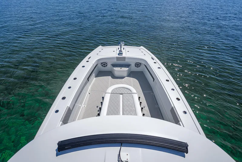  Yacht Photos Pics 2024 Freeman 43 boat on clear water, showcasing spacious deck and sleek design.