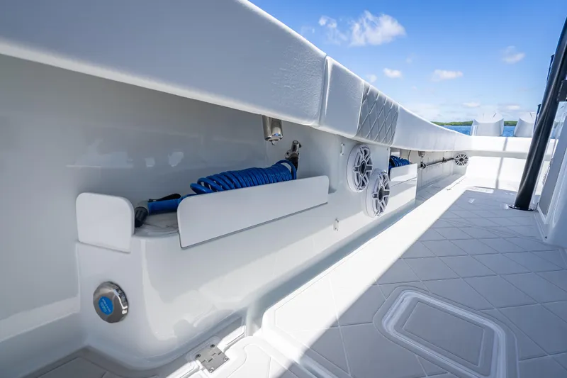  Yacht Photos Pics 2024 Freeman 43 boat deck with storage compartments and marine speakers.