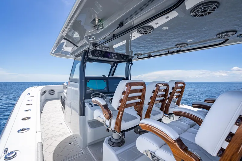  Yacht Photos Pics 2024 Freeman 43 boat interior with luxurious seating and advanced navigation system on open water.