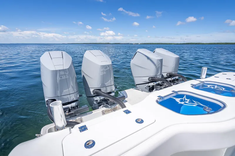  Yacht Photos Pics 2024 Freeman 43 boat with four powerful outboard engines on open water.