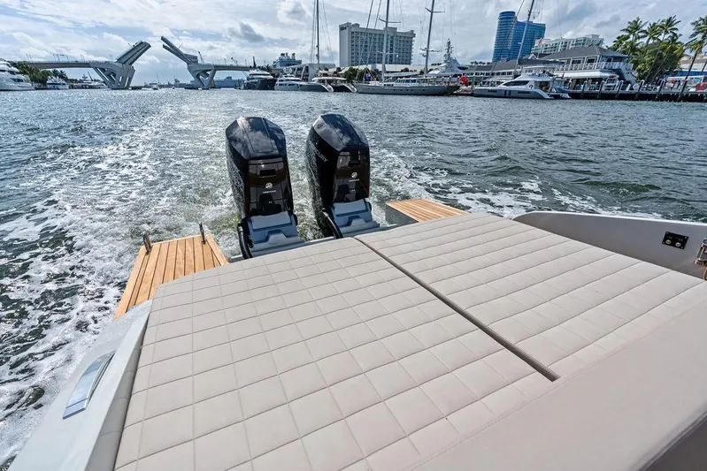  Yacht Photos Pics 2025 SACS 40 Rebel boat with dual engines cruising in a marina.