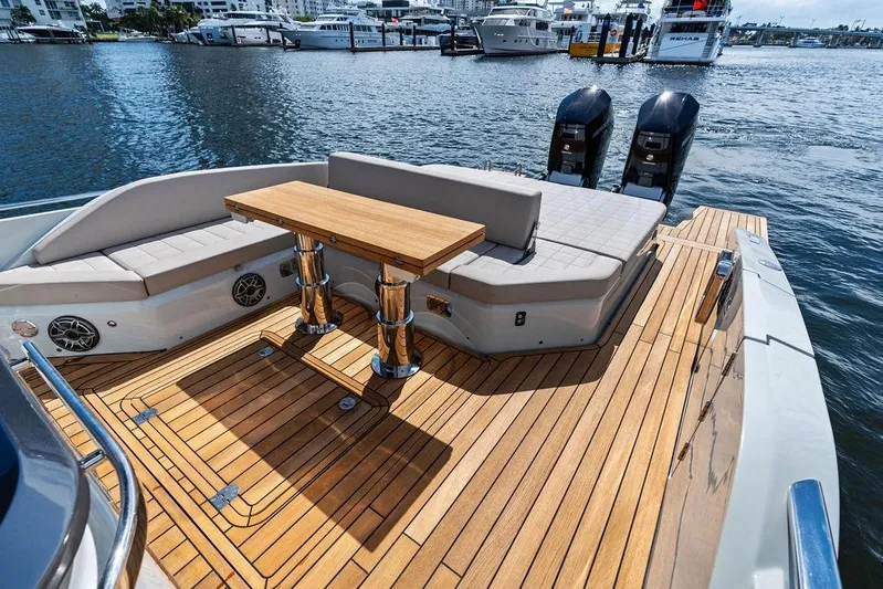  Yacht Photos Pics Luxurious 2025 SACS 40 Rebel yacht with elegant teak deck and comfortable seating.