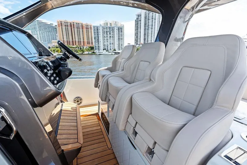  Yacht Photos Pics Luxurious interior of 2025 SACS 40 Rebel yacht with plush seating and modern controls.