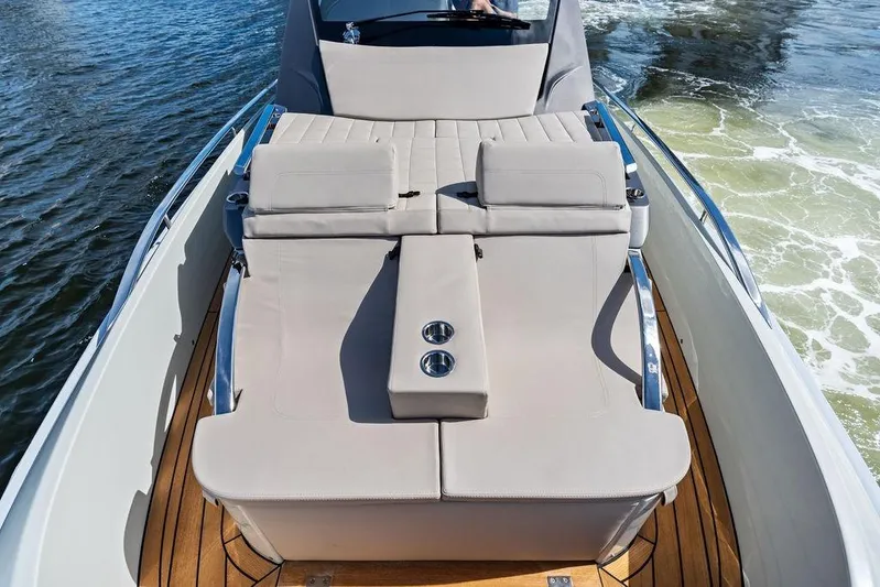  Yacht Photos Pics 2025 SACS 40 Rebel luxury boat with sleek seating and wooden deck on water.