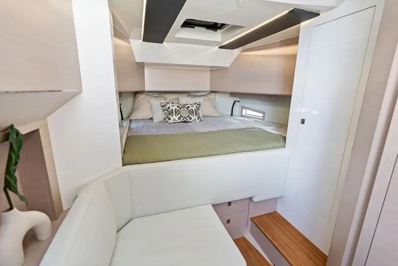  Yacht Photos Pics Luxurious interior of 2025 SACS 40 Rebel yacht featuring a cozy bedroom and modern design.
