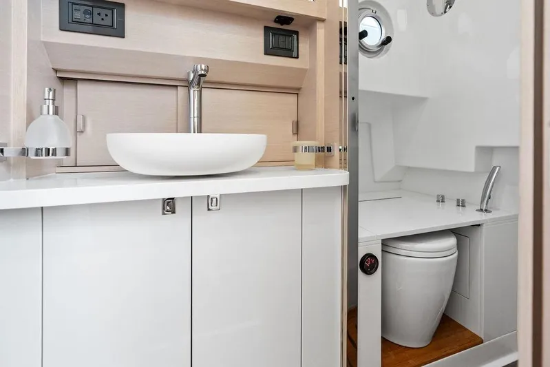  Yacht Photos Pics Modern bathroom interior of 2025 SACS 40 Rebel yacht, featuring sleek sink and toilet design.
