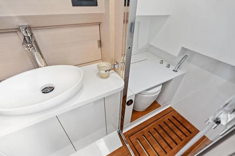  Yacht Photos Pics Luxurious bathroom interior of 2025 SACS 40 Rebel yacht with modern fixtures.
