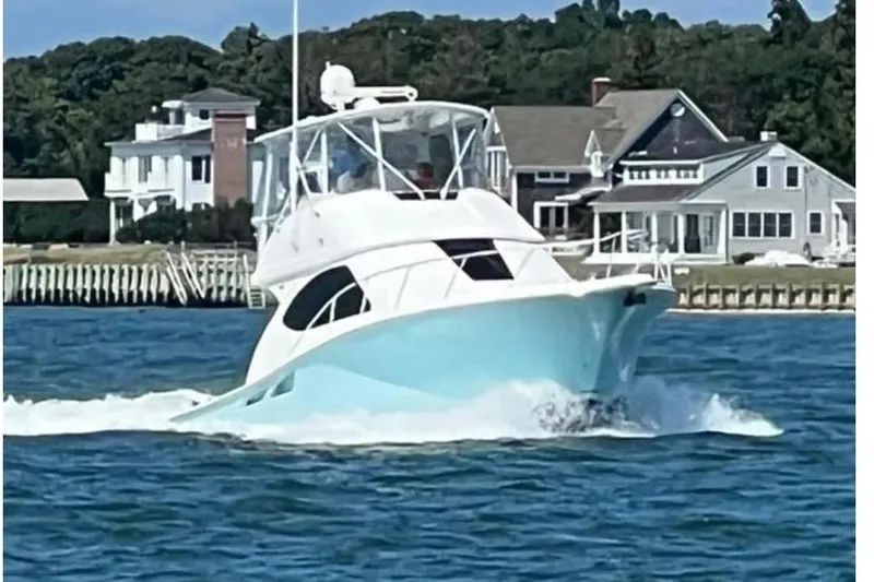 Follow That Stern Ix Yacht Photos Pics 2007 Tiara Yachts 3900 Convertible cruising near coastal homes.