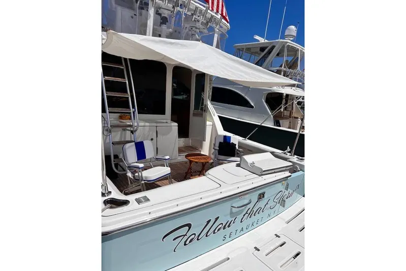 Follow That Stern Ix Yacht Photos Pics 2007 Tiara Yachts 3900 Convertible with seating area and canopy, docked at marina.