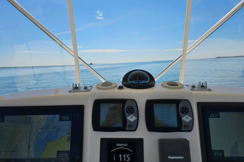 Follow That Stern Ix Yacht Photos Pics 2007 Tiara Yachts 3900 Convertible helm view with navigation screens and ocean horizon.