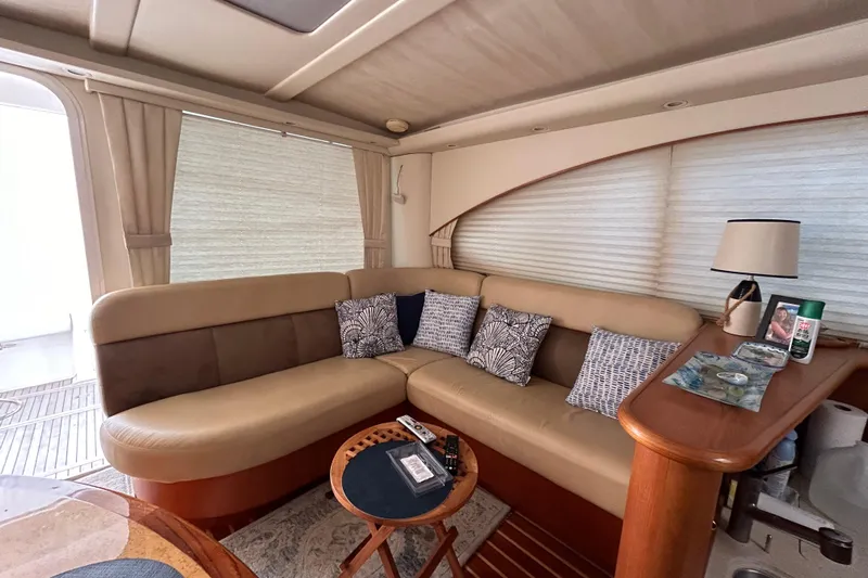 Follow That Stern Ix Yacht Photos Pics Luxurious interior of 2007 Tiara Yachts 3900 Convertible with plush seating and elegant decor.