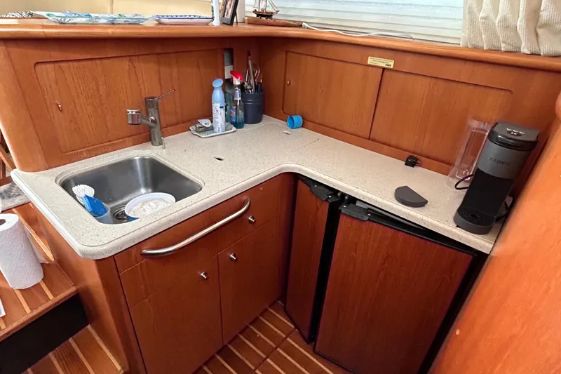 Follow That Stern Ix Yacht Photos Pics 2007 Tiara Yachts 3900 Convertible kitchen with sink, countertop, and appliances.