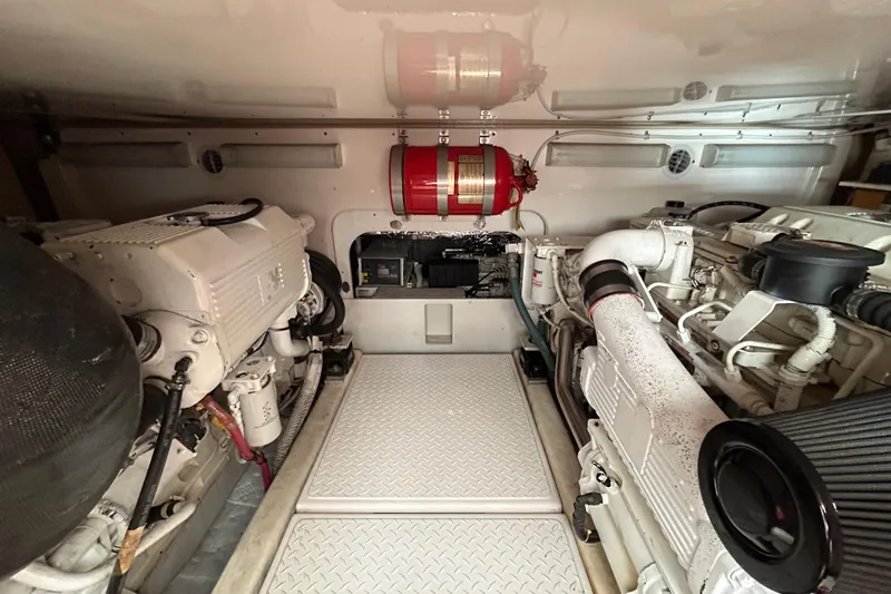 Follow That Stern Ix Yacht Photos Pics Engine room of 2007 Tiara Yachts 3900 Convertible, featuring dual engines and fire suppression system.