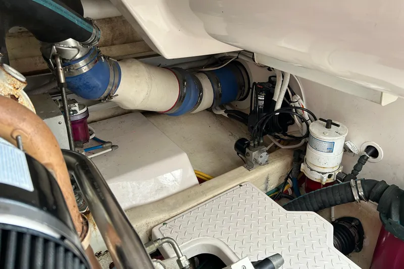 Follow That Stern Ix Yacht Photos Pics Engine compartment of a 2007 Tiara Yachts 3900 Convertible, showcasing mechanical components and hoses.